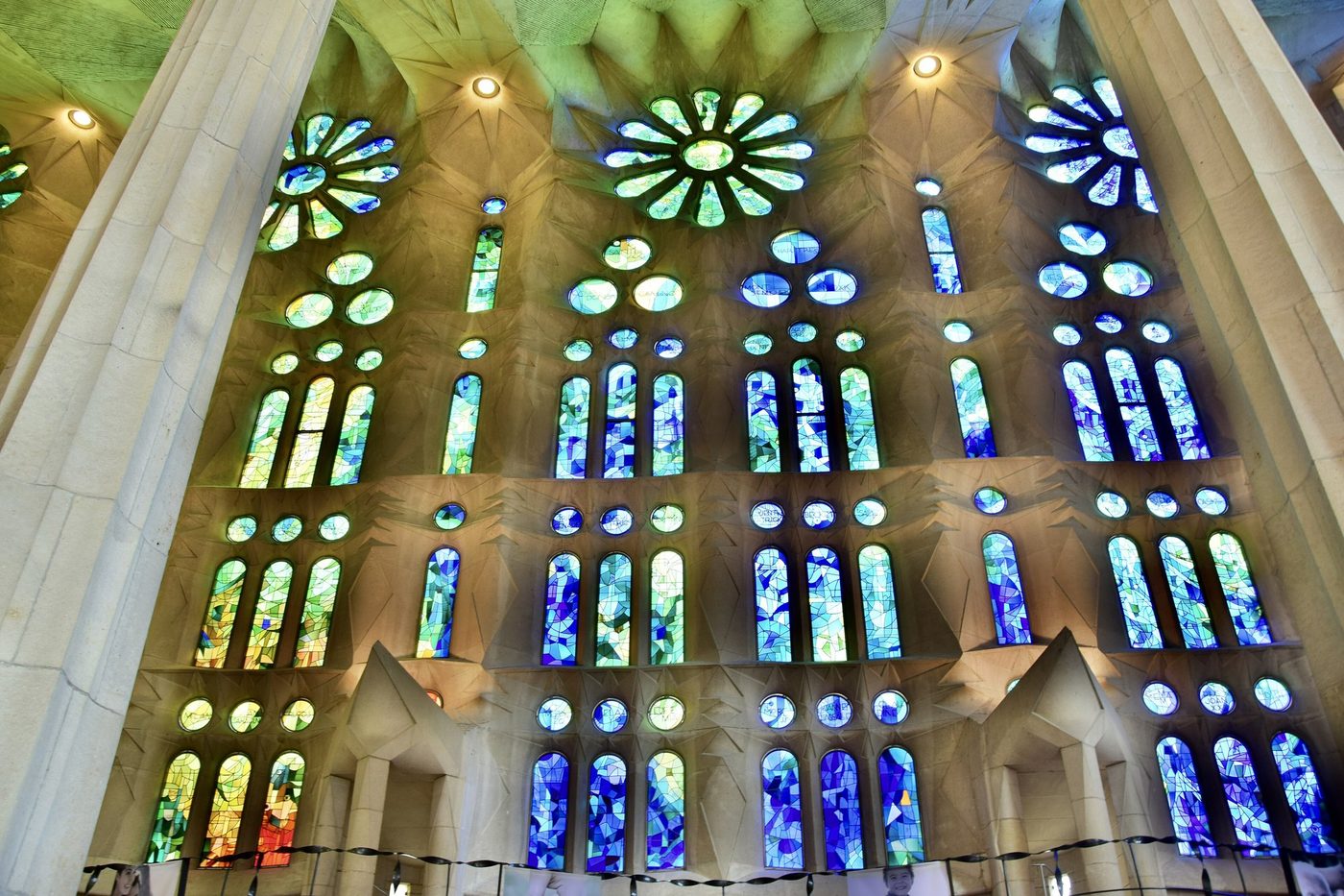 Blue and green stained glass on the Nativity side.