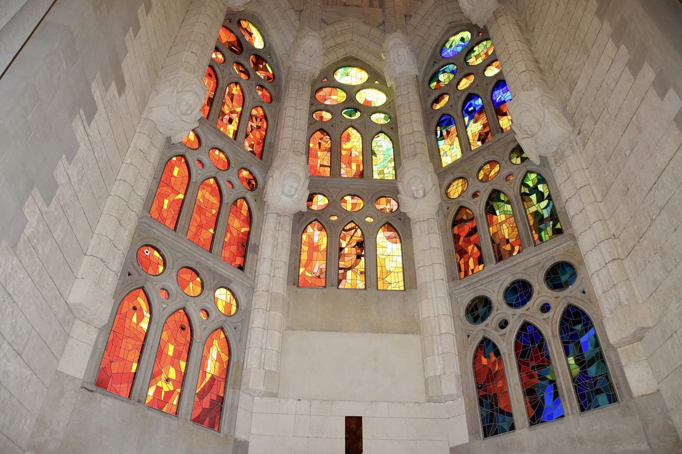 Red and orange windows beside blue glass