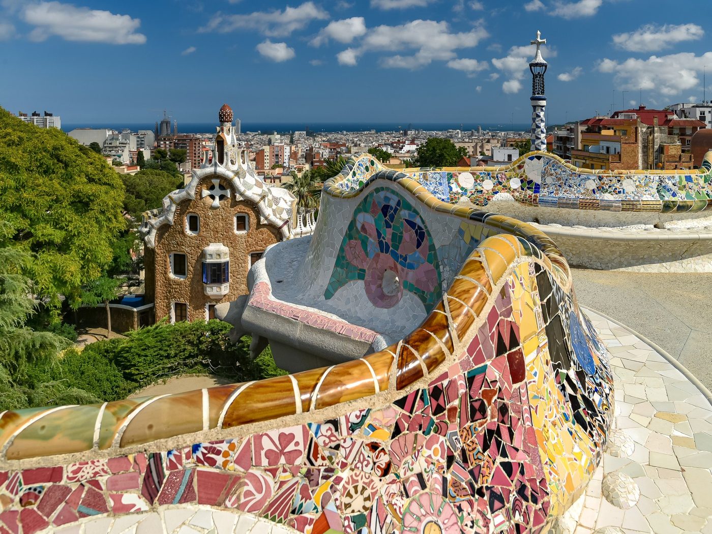 Park Güell's terrace bench with the sea beyond.