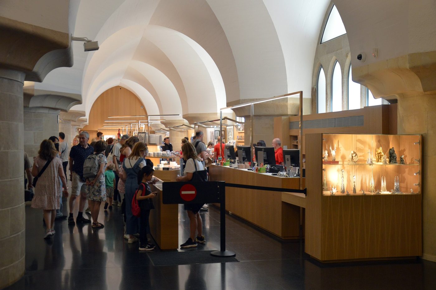 Museum hall with visitors and display cases