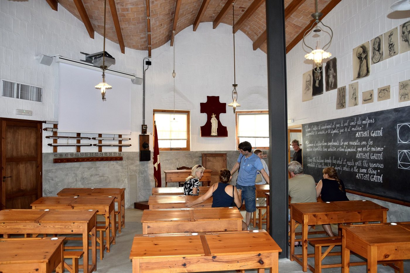 Wooden desks and a blackboard in the Schools classroom