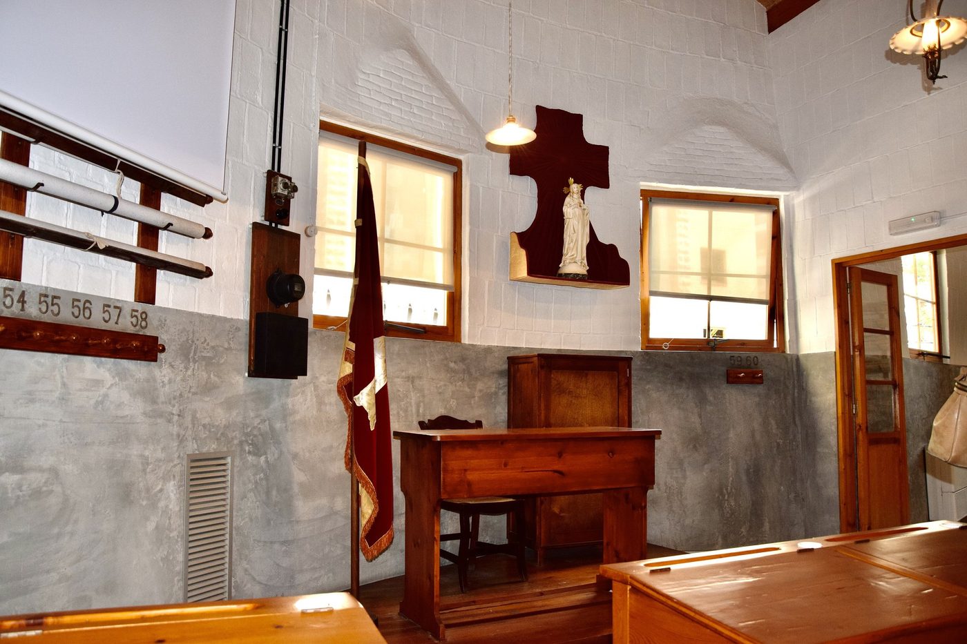 The teacher's desk and windows in the Schools classroom