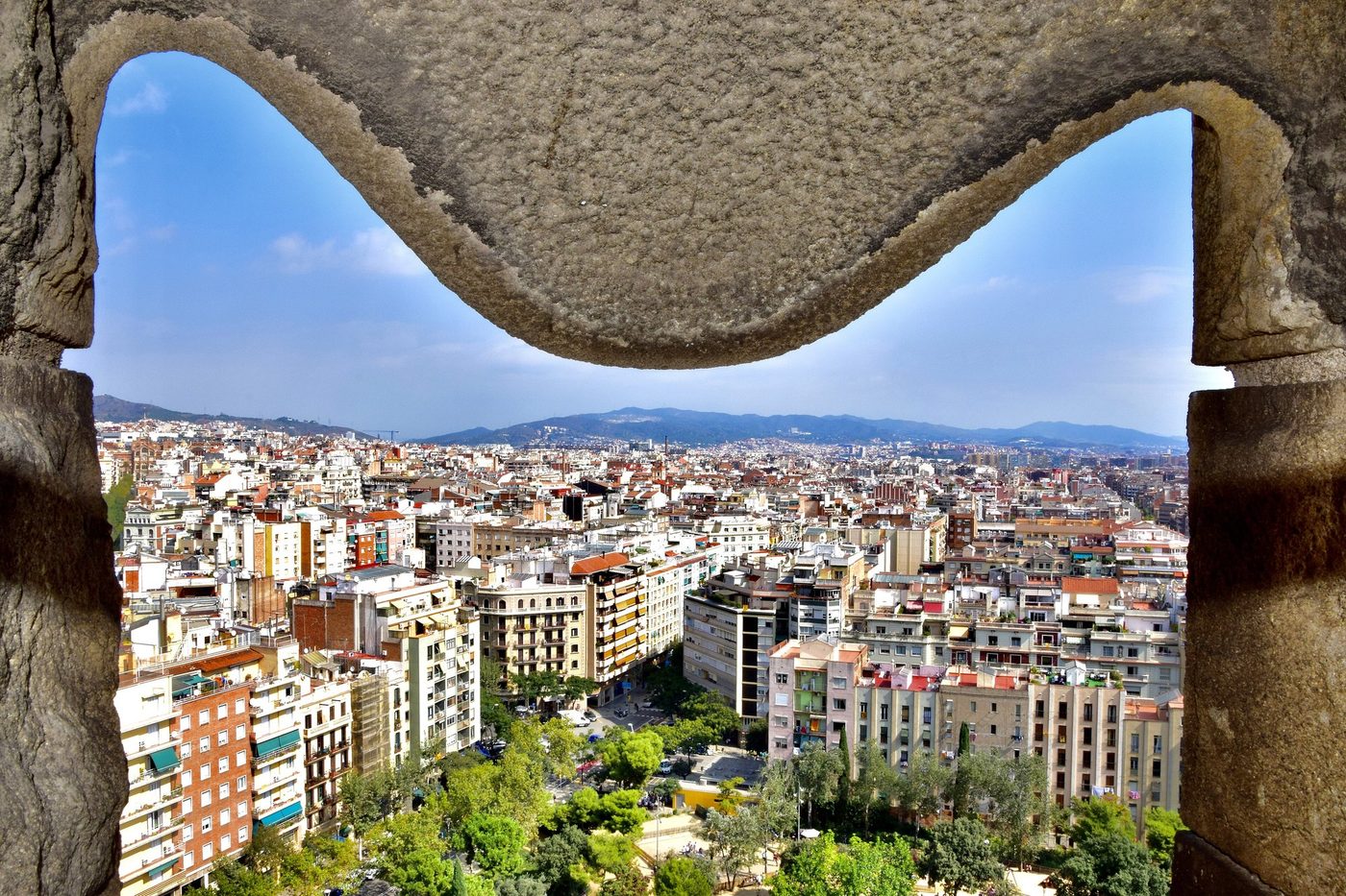 Barcelona and the hills through a tower opening
